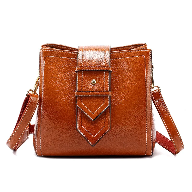 Crossbody حمل حقائب السيدات جلد طبيعي حقيبة يد المرأة صغيرة الكتف حقيبة ساعي الإناث أعلى مقبض حقيبة الشرابة جديد T18 Crossbody حمل حقائب السيدات جلد طبيعي حقيبة يد المرأة صغيرة الكتف حقيبة ساعي الإناث أعلى مقبض حقيبة الشرابة جديد T18