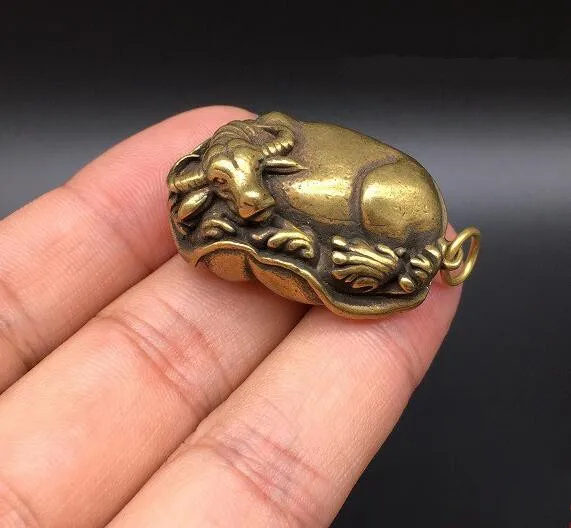 

Chinese pure brass water buffalo lie on lotus leaves small statue