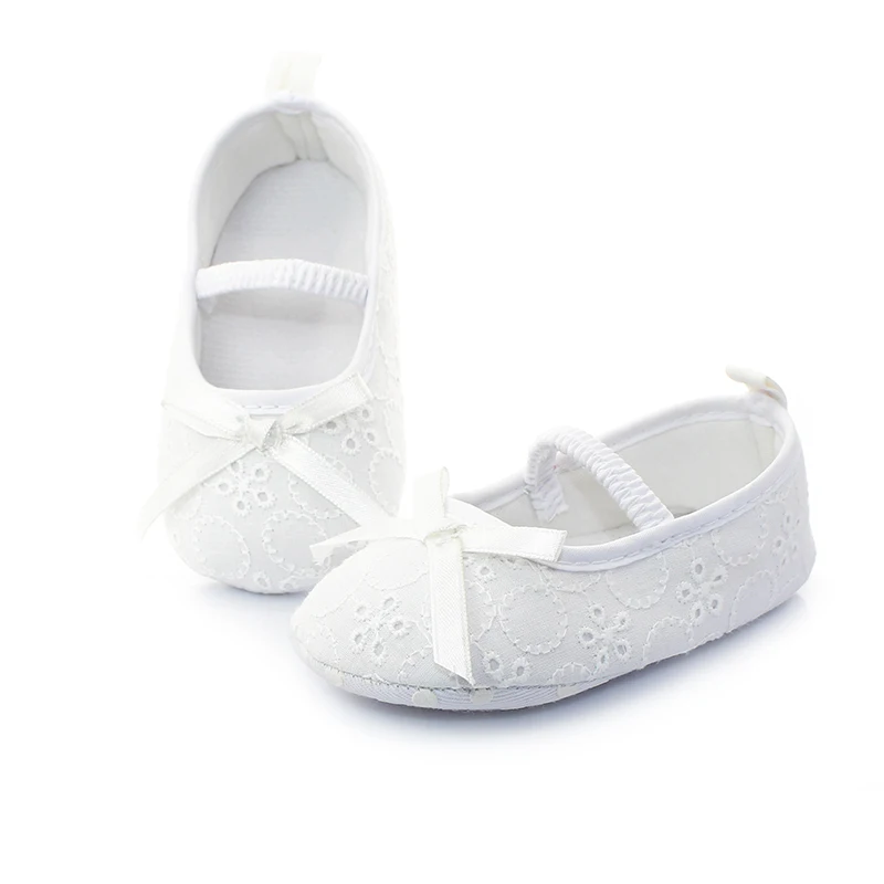 newborn white shoes girl