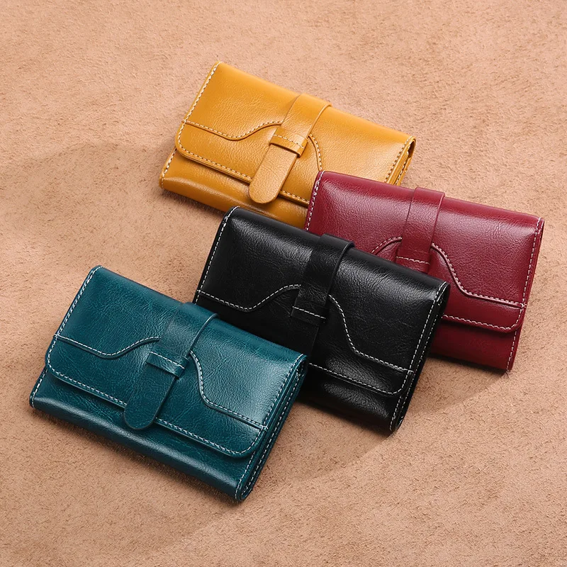 

New ladies leather multi-card wallet short student Korean cute leather wallet folding buckle purse wallet