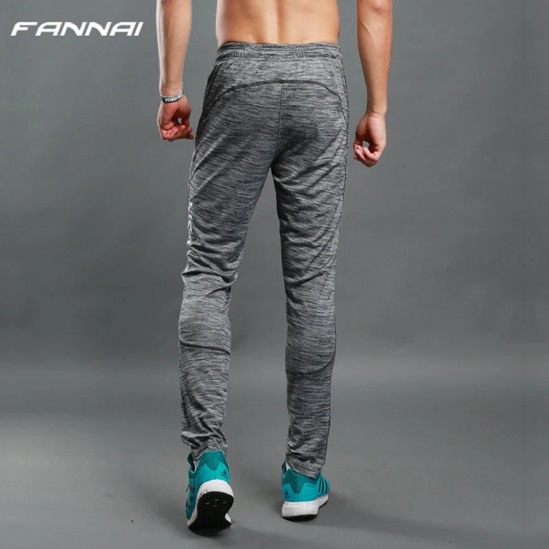 Tanie Mężczyźni przebiegu spodnie do joggingu kieszenie siłownia sport sportowe piłki nożnej piłka nożna szkolenia sportowe spodnie elastyczność na zewnątrz spodnie do joggingu