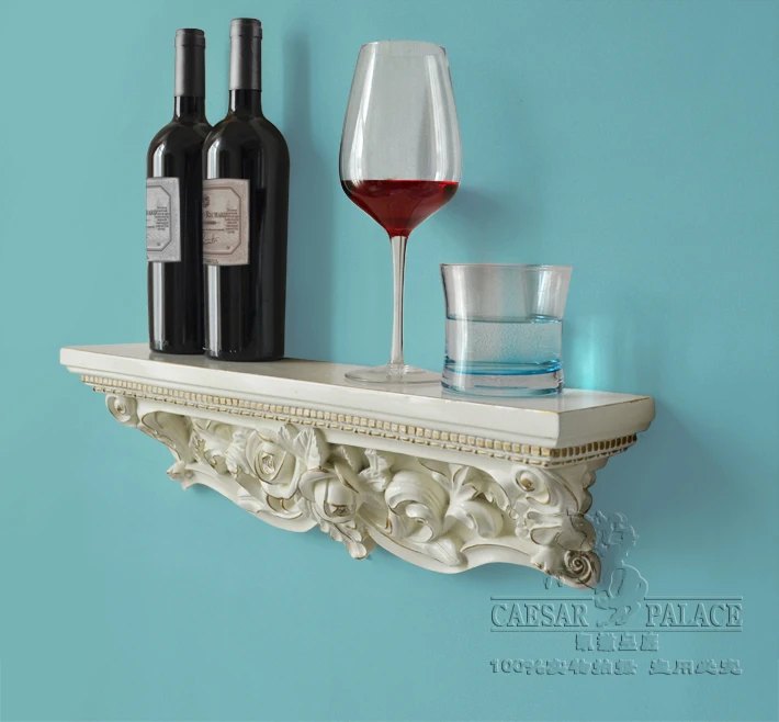 A word shelf/partition of carve patterns or designs on woodwork shelf. Hanging bracket.