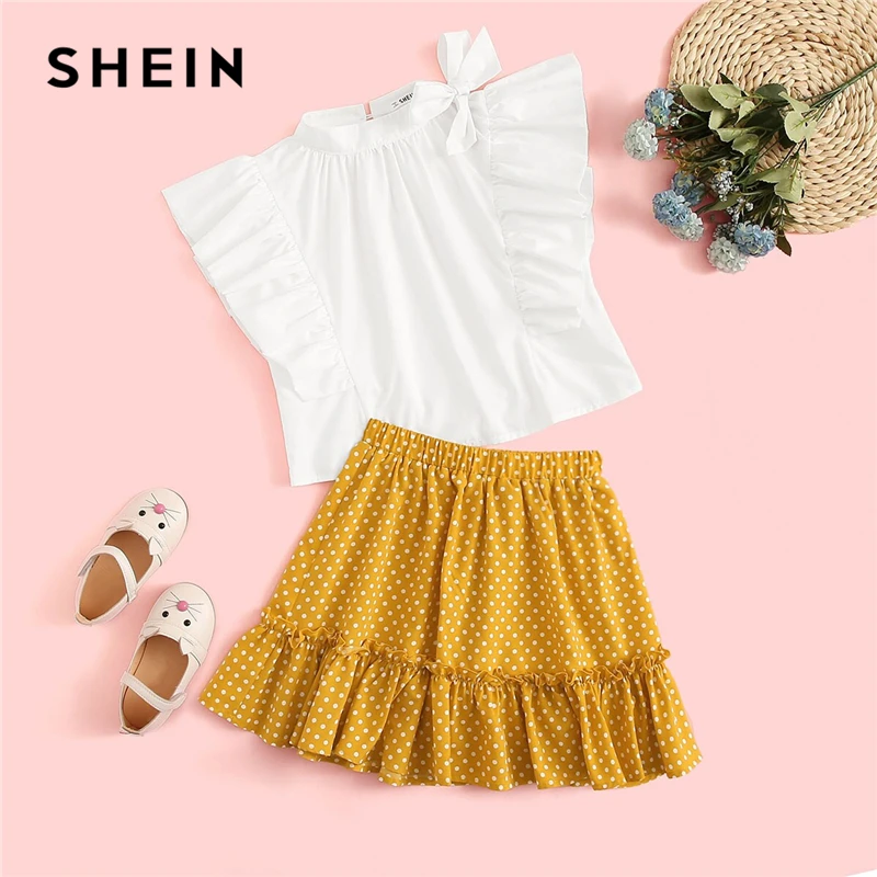 

SHEIN Kiddie Girls Tie Neck Ruffle Blouse And Polka Dot Skirt Cute Suit Set 2019 Summer Stand Collar Bow Button Back Kids Outfit