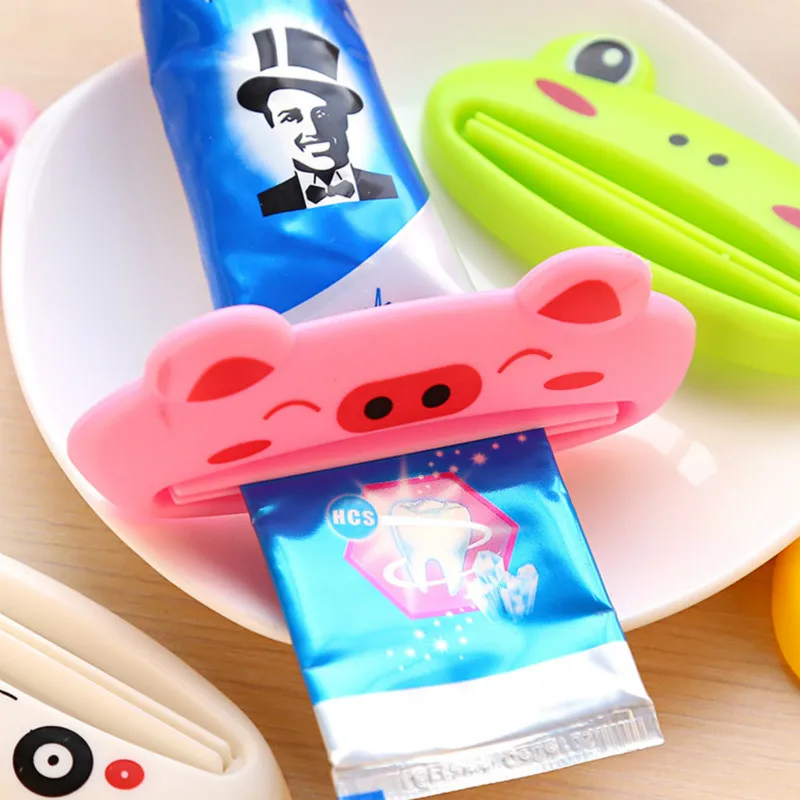 

HOT Bathroom Home 4pcs Tube Rolling Holder Squeezer Easy Cartoon Toothpaste Dispenser 2018 Toothpaste Dispenser Rolling Holder