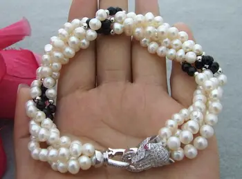 

Hand knotted white freshwater aquaculture pearl and black stone micro inlay zircon accessories dragon head clasp pearl bracelet