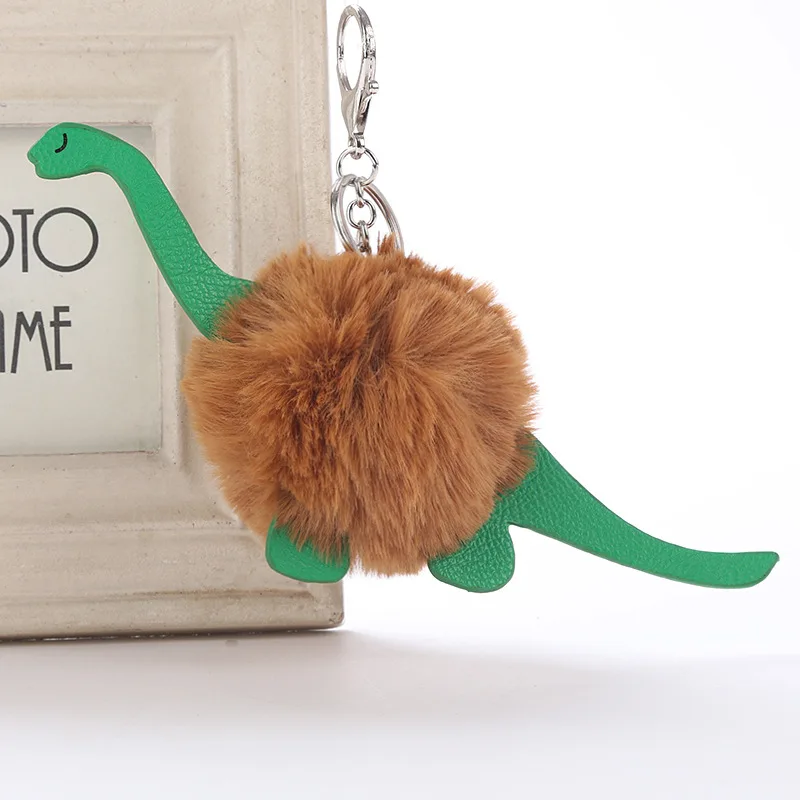 

Cute Fluffy Dinosaur Pom Pom Keychain Fake Rabbit Fur Ball Leather Key Chains Women Bag Car Trinket Gold Key Holder 6C2383
