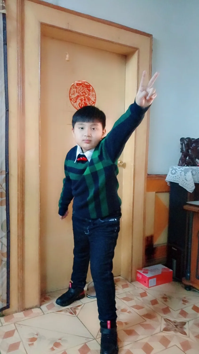 The boy's new casual sweater
