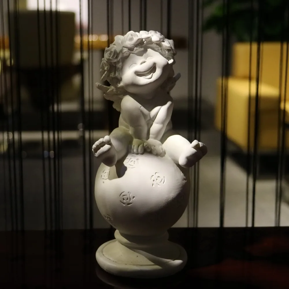 

handmade white laughing angel sitting on the ball ornaments resin crafts modern home decoration cute happy angel figurine statue
