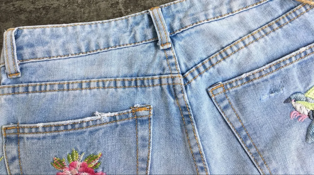 2017 Europe and the United States women's 3D three-dimensional heavy craft bird flowers front and rear side embroidery high waist straight irregular wear jeans (25)