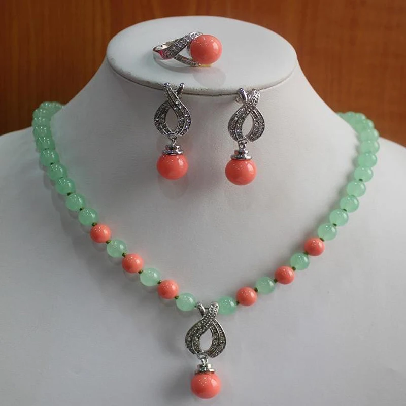 

The lady's Pearl Necklace/Earrings/Ring jewelry set is engaged.-5F6RTT