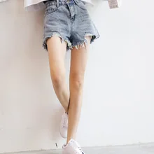 summer women wild loose grinding holes irregular high waist denim shorts