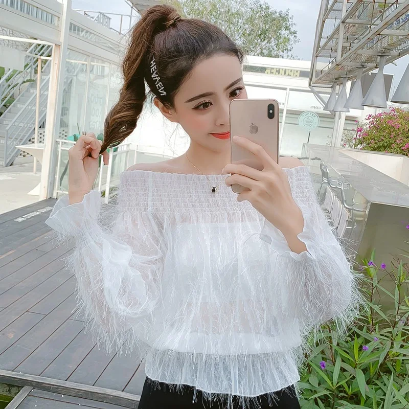 

2019 spring and summer new word collar off-shoulder shirt small fresh fur tassel chiffon shirt puff sleeve sweet top