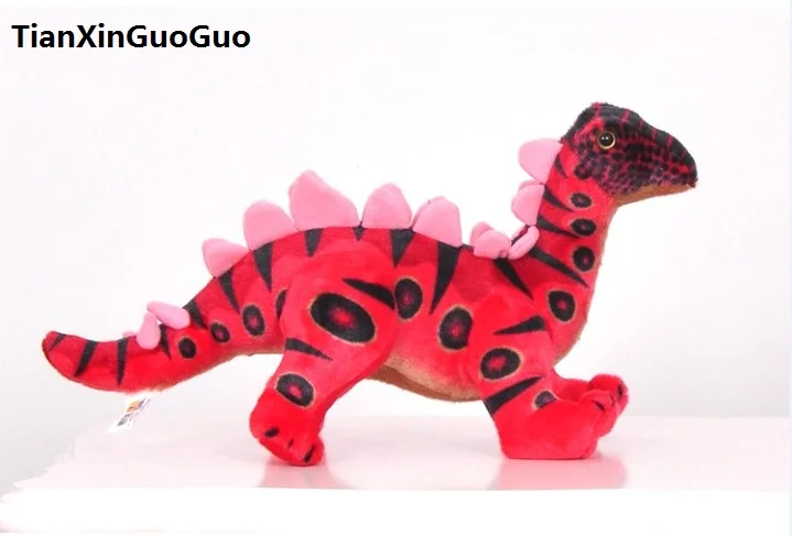 red stuffed dinosaur
