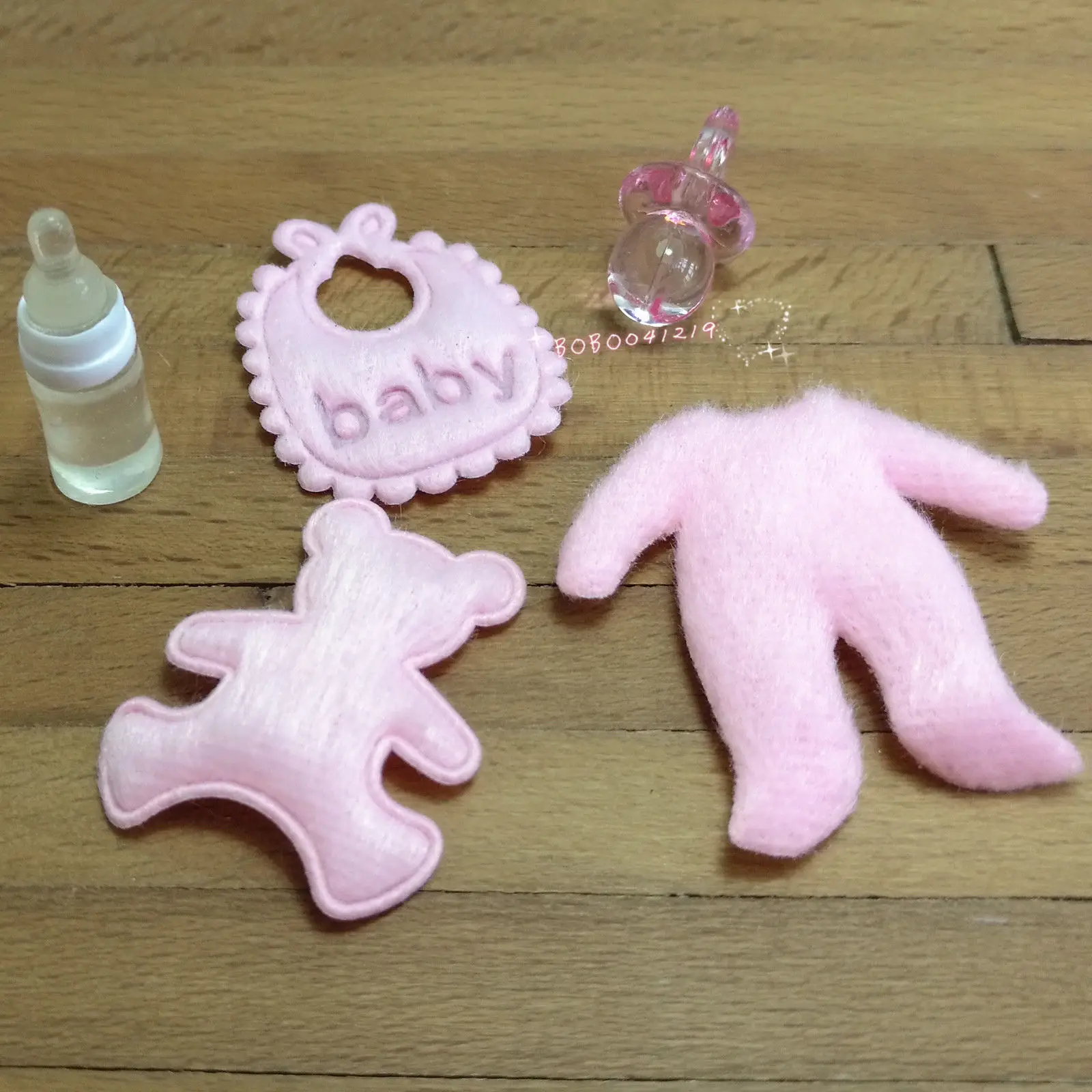 

Dollhouse Miniature 1:12 Plastic Baby Items Set Length 2.6cm Pink SPO420