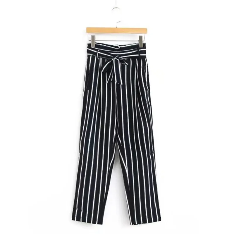 Black and white patterned trousers Simple Black and White. When you’re wearing black and white pinstriped pants, a white or black top is usually the safest option. At the office, pair your pinstriped pants with a crisp, white button-down blouse and black pumps for a polished, professional look.