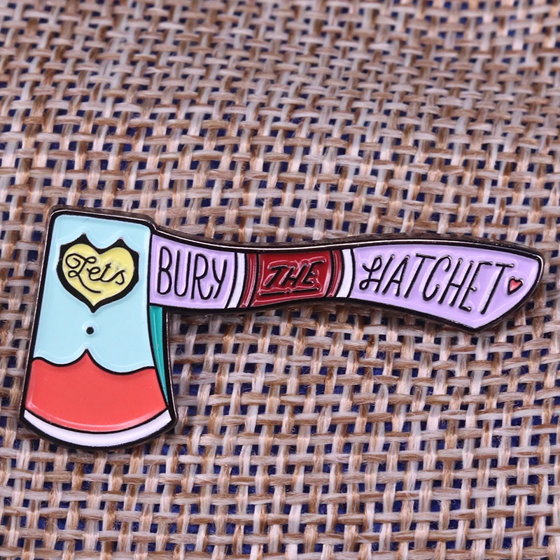 

Let's bury the hatchet enamel pin mystery murder brooch lilac axe badge pastel Goth Halloween accessory