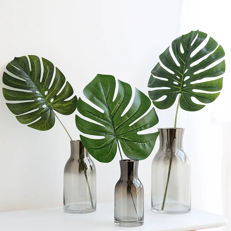

12Pcs Large Artificial Fake Monstera Palm tree Leaves Green Plastic Leaf Wedding DIY Decoration Cheap Flowers Size Leaves Plant