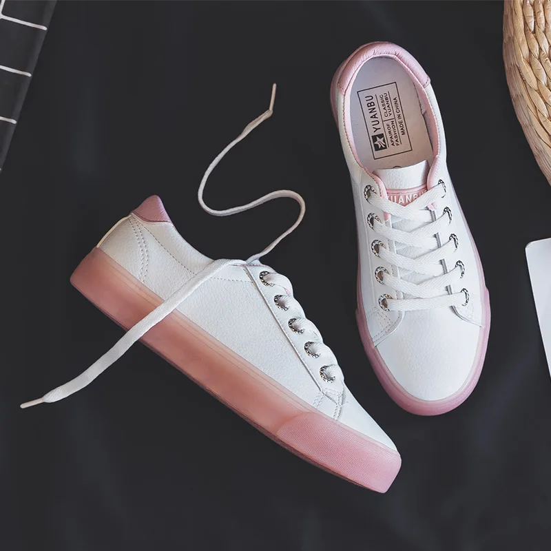 white sneakers with pink soles
