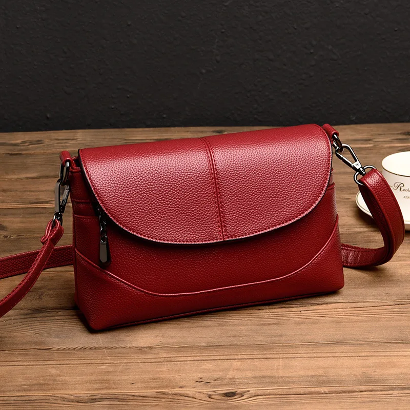 purple leather messenger bag