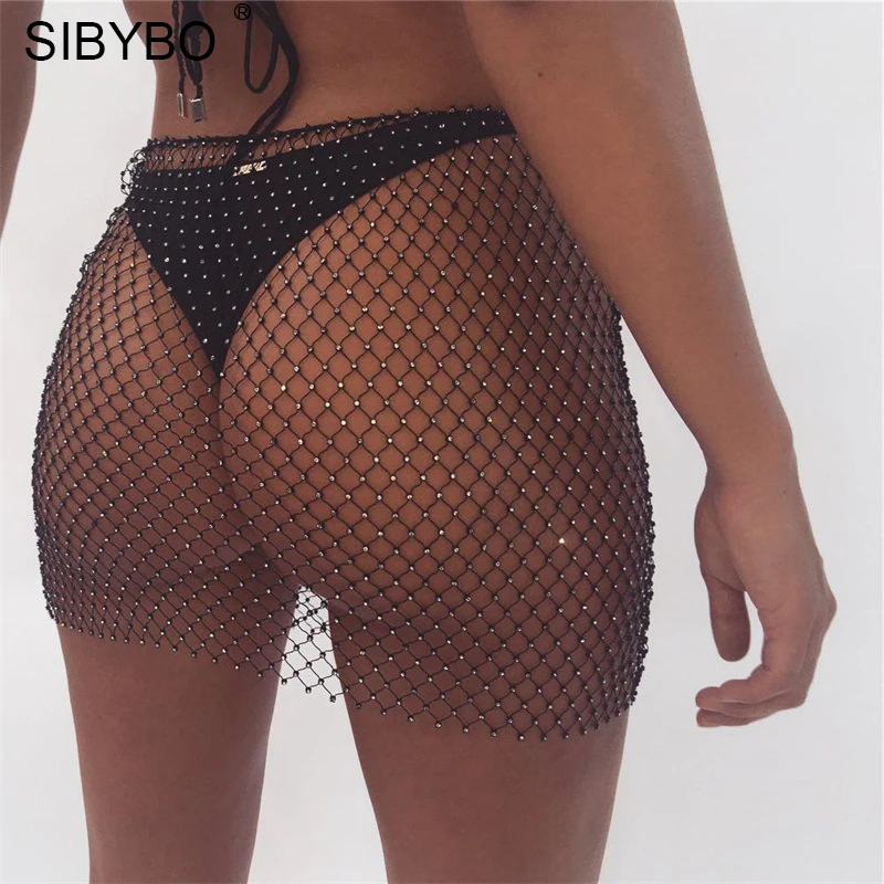 

SIBYBO Fish Net Rhinestone Skirts Womens 2019 Fashion Mesh Diamond See Through Beach NightClub Package Hip Mini Pencil Skirt