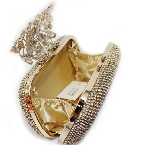 Сумка клатч с металлическим цветком и стразами серебристая/Золотая/черная для