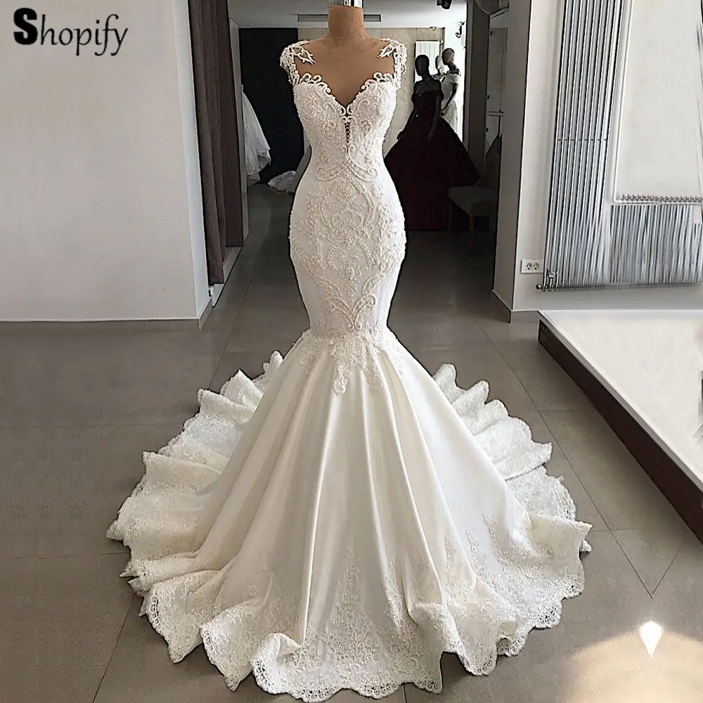 Romantic Mermaid Wedding Dresses 2020 Sexy Sheer Back Beaded Lace Bride Real Saudi Arabia Ivory Wedding Gown Romantic Mermaid Wedding Dresses 2020 Sexy Sheer Back Beaded Lace Bride Real Saudi Arabia Ivory Wedding Gown