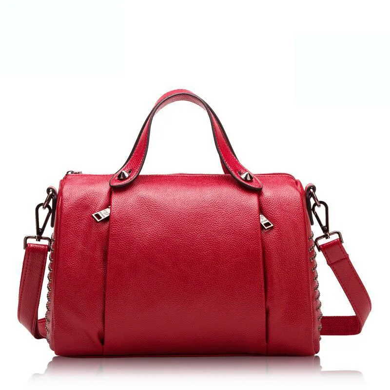 Ms. new European and American style wind rivet leather cowhide pillow bag Real leather white cross-type portable leather shoulde