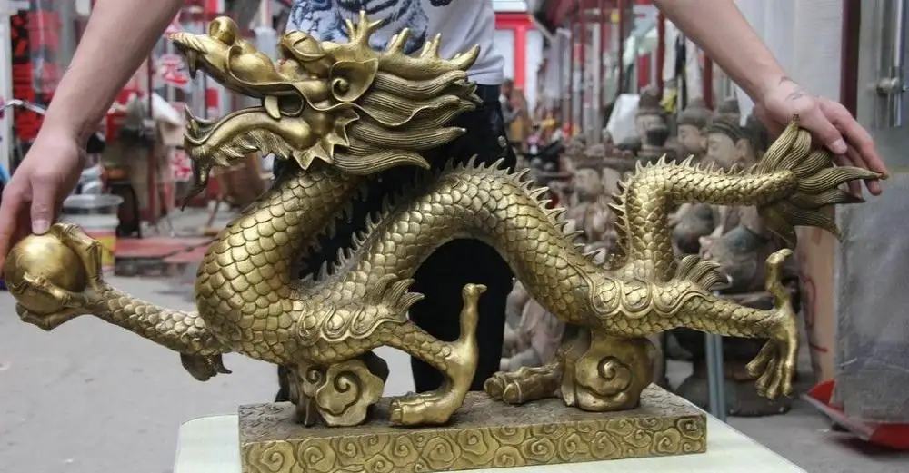 

Chinese Bronze Copper Fenghshui Auspicious Fly Dragon Hold Bead Statue Sculpture