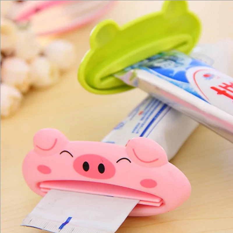 ISHOWTIENDA 1PCS 9cm x 4 cm Cute Animal Bathroom Home Tube Rolling Holder Toothpaste Squeezer Easy Cartoon Toothpaste Dispenser