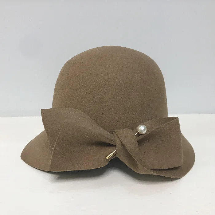 winter bucket hat 2019 Autumn And Winter New Bucket Basin Of Bowknot Pearl Wool Hat Female Warm Fashion Female Warm black fur bucket hat