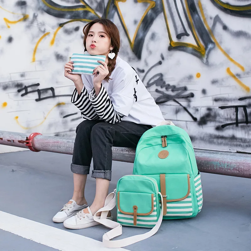 

The new 2018 contracted han edition printed canvas bag handbag large capacity backpack female in college students' school bag