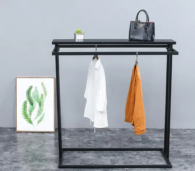 A display rack in the middle island shelf. Double row middle shelf. Parallel bars side hangers iron clothes hanger..062