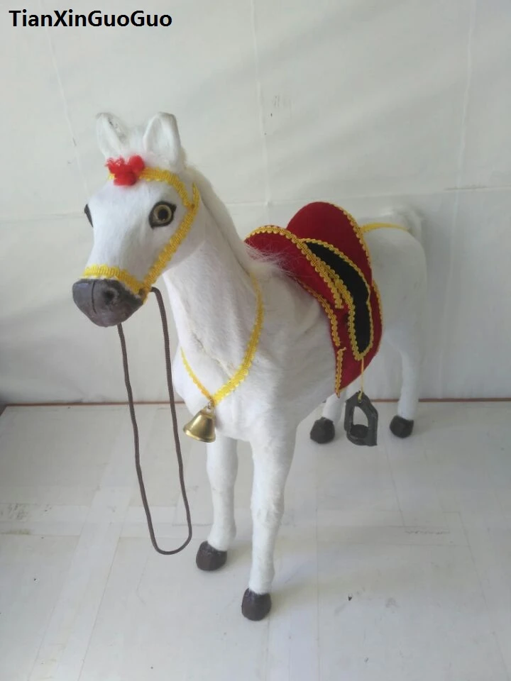 large stuffed horse with saddle