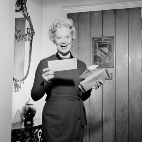 Senior woman opening and reading letter Poster Print (24 x 36)