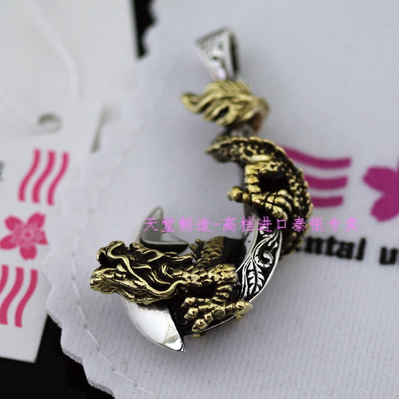 

Oriental vibrations pure silver fish hook pendant