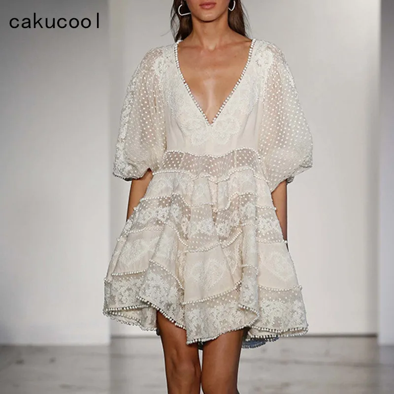 

Cakucool High-end New Lace Women Dress Hollow Out V neck Lantern Sleeve Slim Mini-dress Ruffled Vocation Beach Dress Apricot