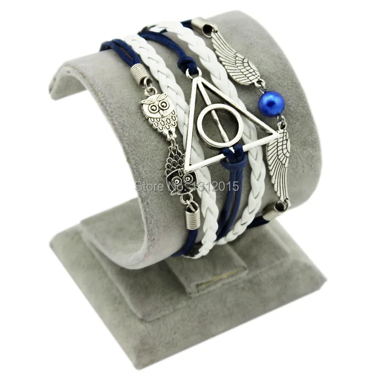 

Min.order is $8(mix order) Free Shipping New wholesale blue wing Illuminati Infinitely fashion women leather Bracelets ZC004