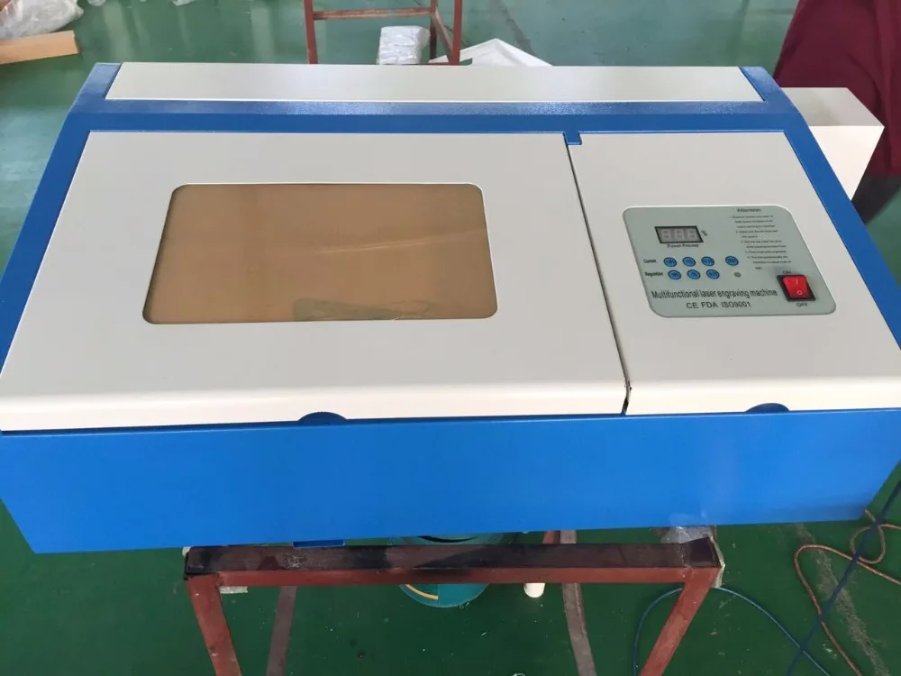 

320 laser cutting machine with 50w CO2 laser tube and honey comb working table