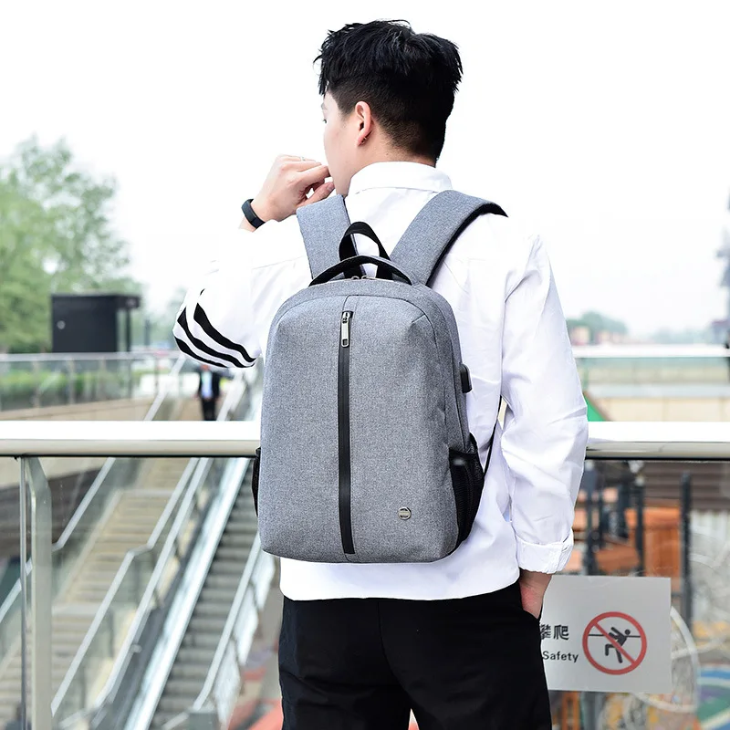 

2019 new simple solid color leisure waterproof breathable USB rechargeable computer bag backpack