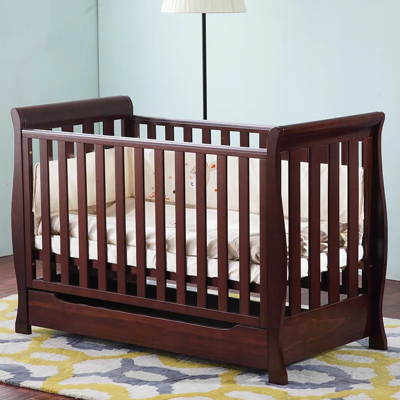 crib connected to bed