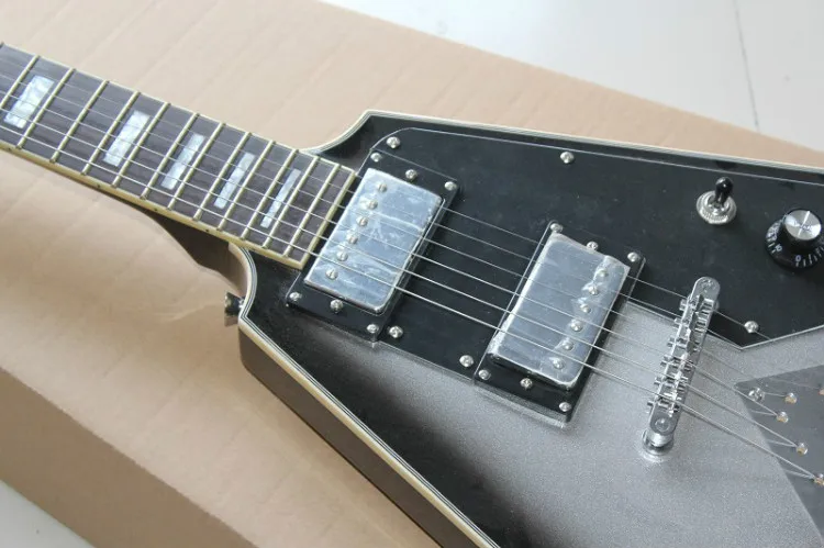 

Irregular shaped red/black/grey electric guitar with pickup