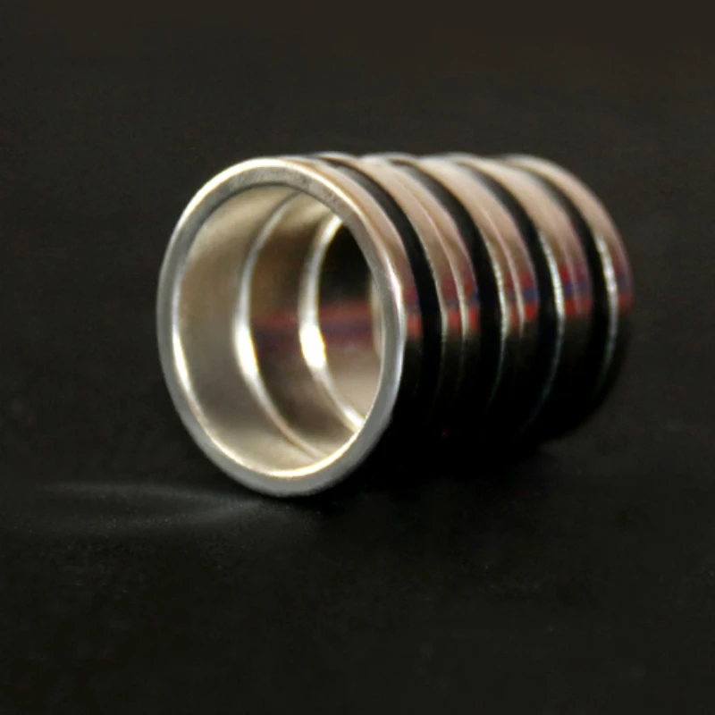 

Free shipping 4pcs large size Easy to Use Magical Magic Tricks Magic Ring Props PK Strong Magnetic Rings