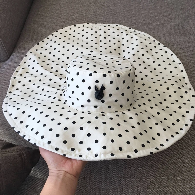 

Spring and summer small fresh wave point white neck guard sun hat irregular large brim sun hat elegant goddess fisherman hat