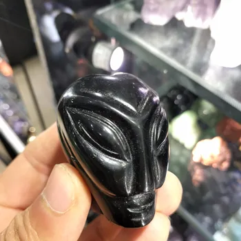 

Natural obsidian hand-carved alien heads