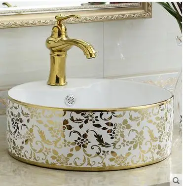 

On the ceramic bowl round art basin lavatory toilet lavabo coloured drawing or pattern color gold