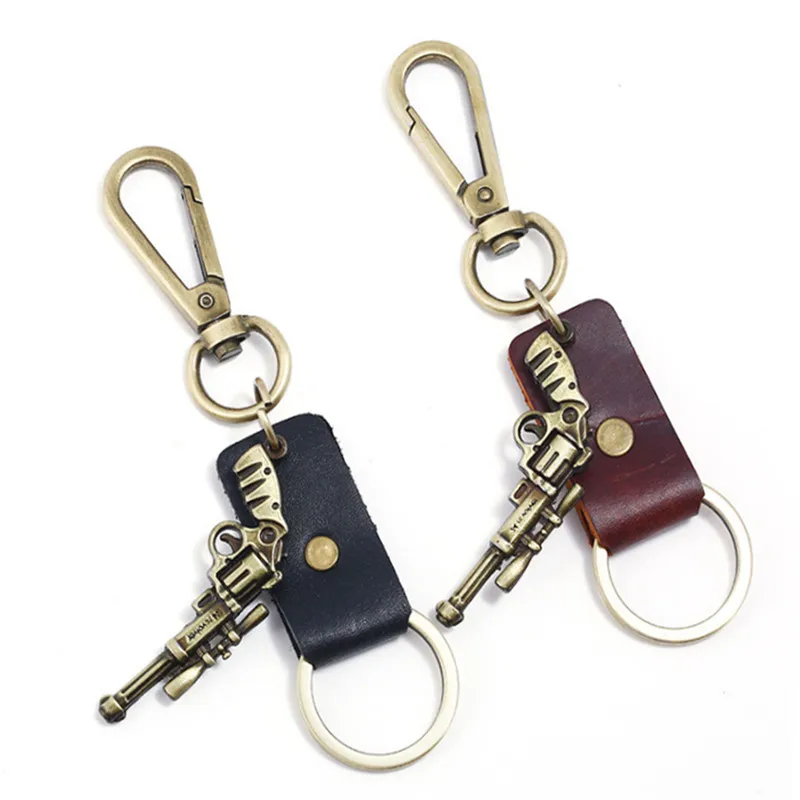 Fashion Men Revolver Bronze Pistol Weapon Keychain Leather Key Rings Newest Gun key Chain For Women Charm Jewelry Surprise Gifts Fashion Men Revolver Bronze Pistol Weapon Keychain Leather Key Rings Newest Gun key Chain For Women Charm Jewelry Surprise Gifts