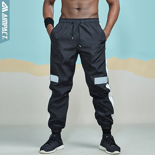Aimpact Светоотражающие спортивные штаны для мужчин, модные хип-хоп повседневные штаны для бега, штаны для бега, Новые Брюки с карманами AM5041 - Цвет: Black