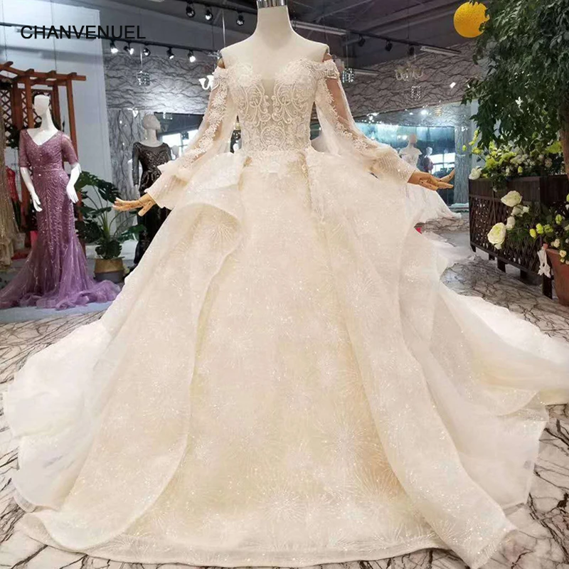 Wedding dress with long sleeves and ruffle bottom top