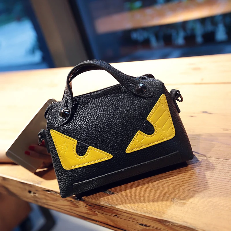 

2017 new female handbag little monsters crashed color eye bag portable oblique satchel rivet package women messenger bag
