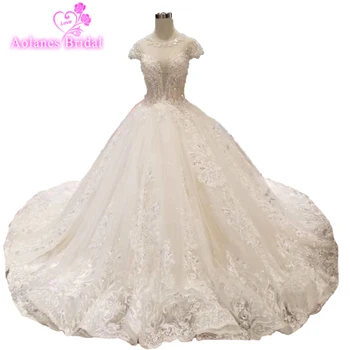شراءتصميم جديد فاخر الكرة ثوب الزفاف 2019 كيب الأكمام بلورات فساتين الزفاف الخرز Vestido De Noiva الدانتيل فساتين زفاف